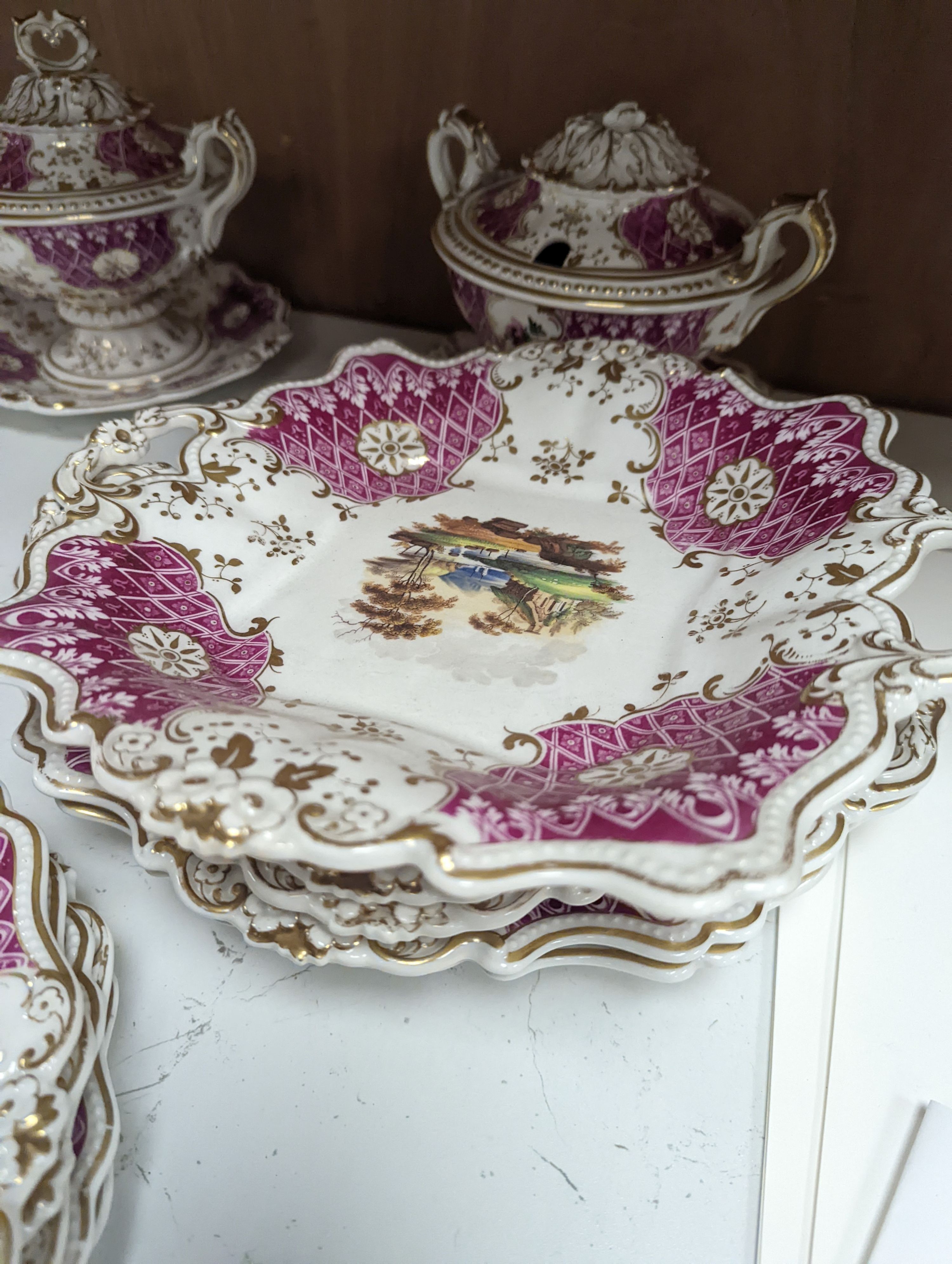 A Ridgways porcelain topographical part dessert service, c.1835, pattern number 2168, the sauce tureens and covers pattern number 2179